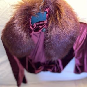 This is a Elie Tahari jacket Maroon